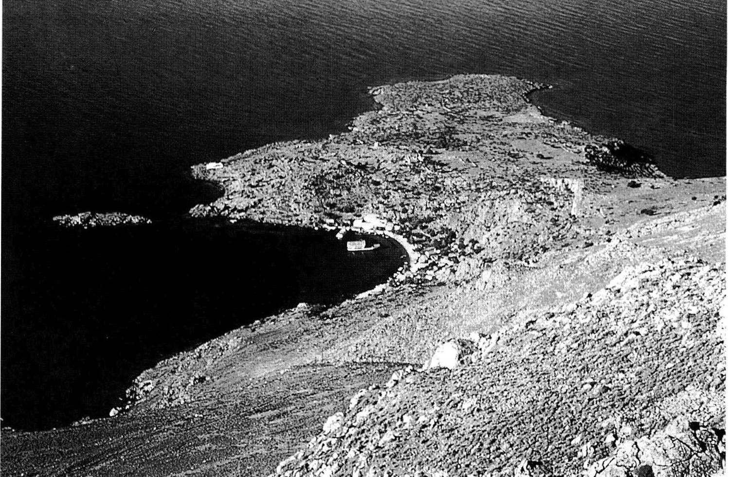 Fig. 2 - Phoinix-Loutro, from Anopolis; modern white buildings around harbour.