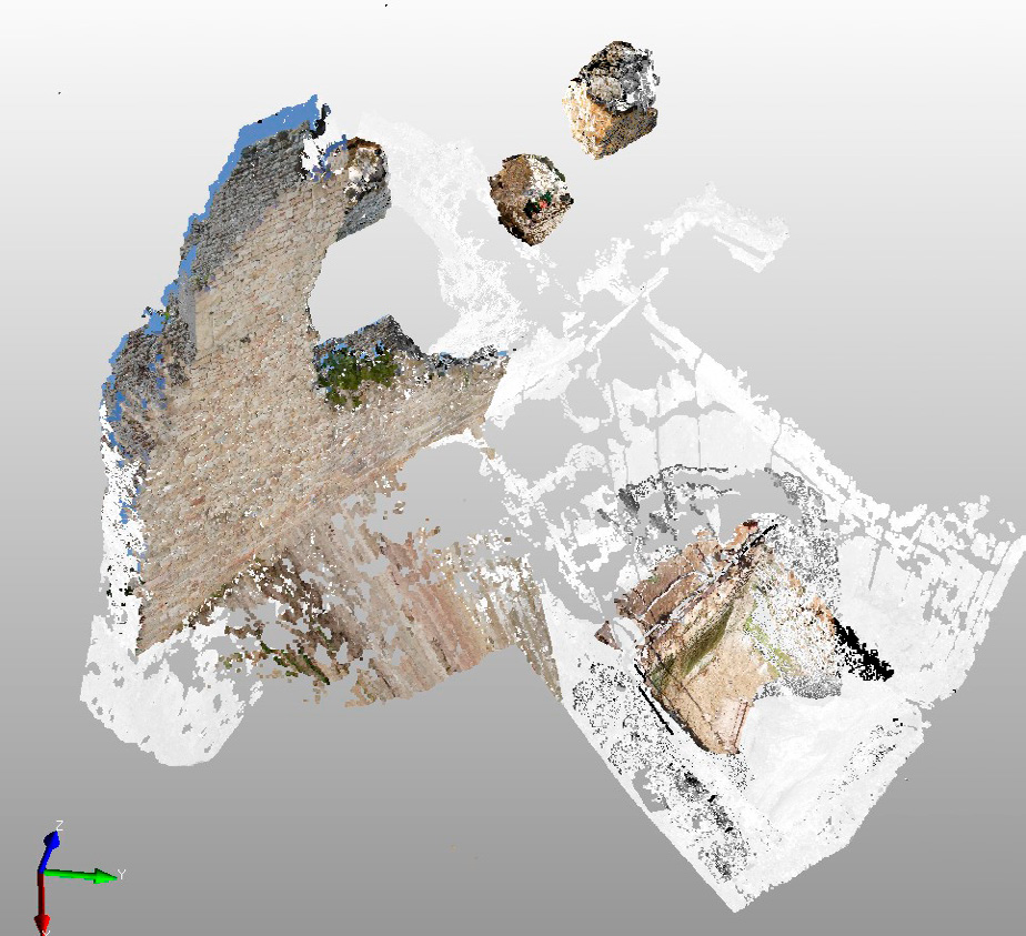 Fig. 10 – Rappresentazione generale della porzione rilevata, visualizzata come nuvola di punti (in grigio), texture mapping (mediante immagini RGB) e con il posizionamento virtuale dei 3 blocchi sul modello finale.