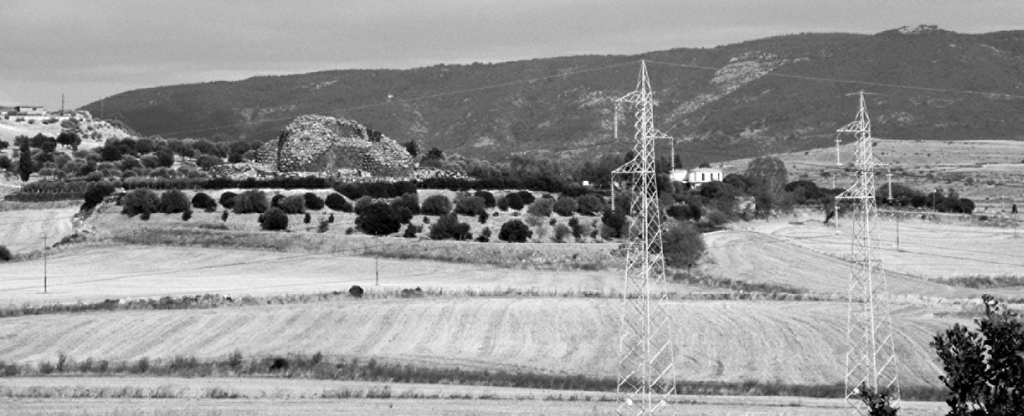 Fig. 1 – Barumini, on the background the nuragic complex of Su Nuraxi.